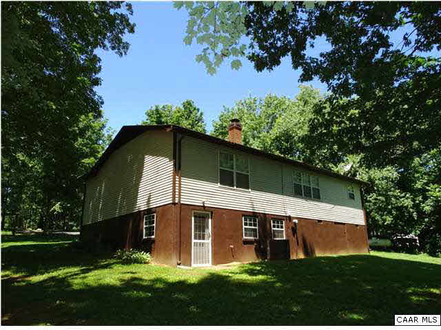 14121 Reva Road Boston, VA 22713 - Photo 4 of 16 a house with green field in front of it