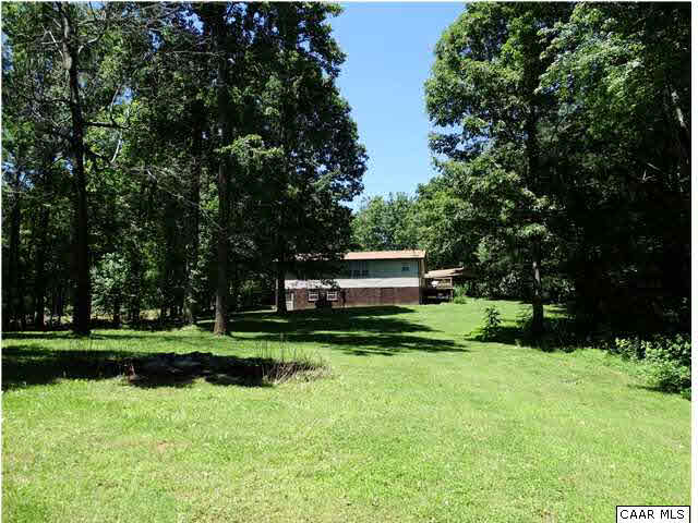 14121 Reva Road Boston, VA 22713 - Photo 5 of 16 a front view of a house with a yard and trees