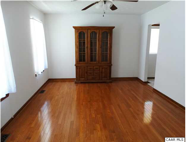 14121 Reva Road Boston, VA 22713 - Photo 7 of 16 an empty room with wooden floor and windows