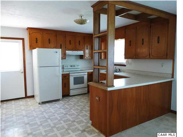 14121 Reva Road Boston, VA 22713 - Photo 8 of 16 a kitchen with stainless steel appliances granite countertop a refrigerator a sink and a stove