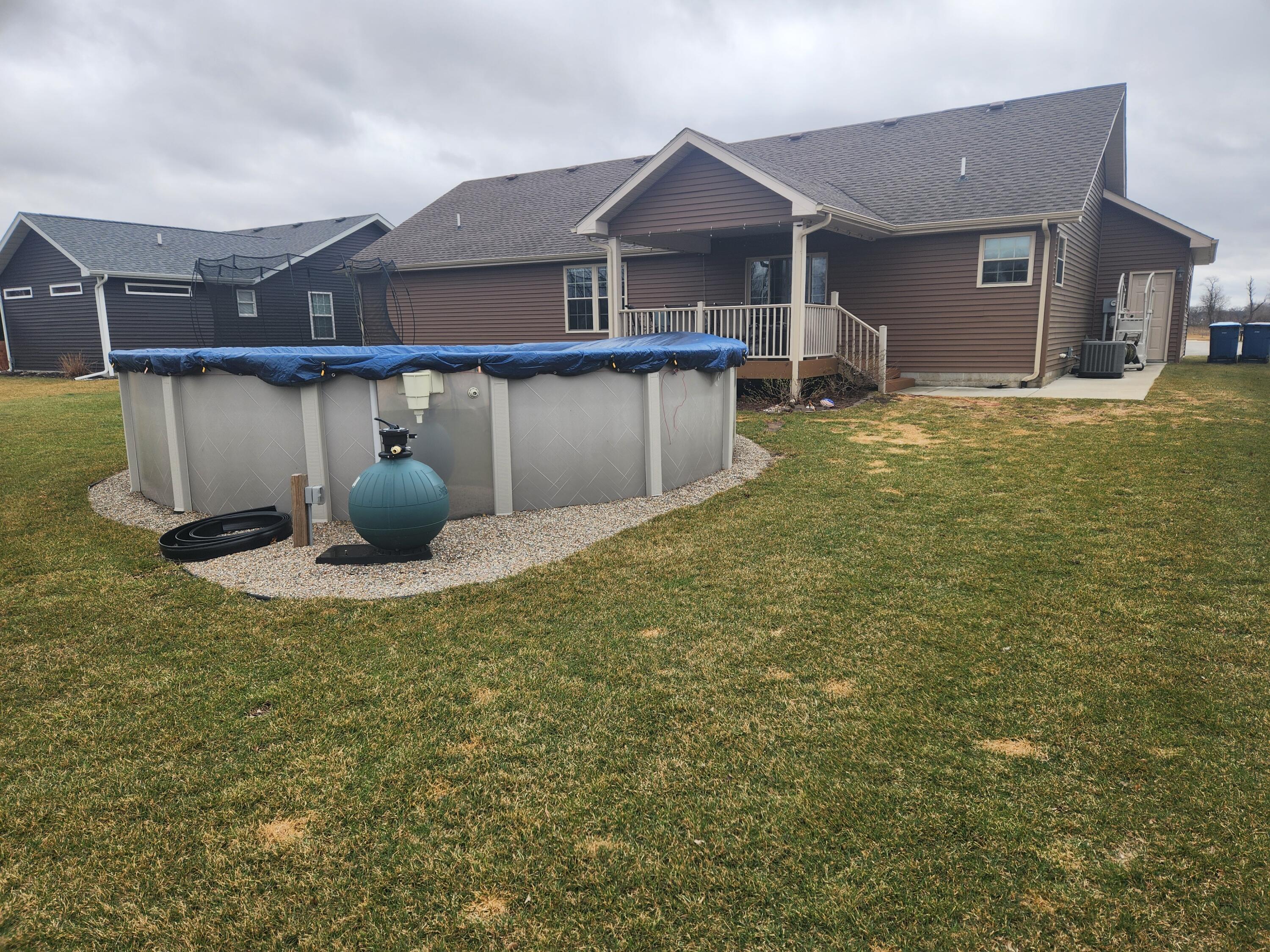 702 19th Street Southeast De Motte, IN 46310 - Photo 21 of 22 a view of a house with backyard and sitting area