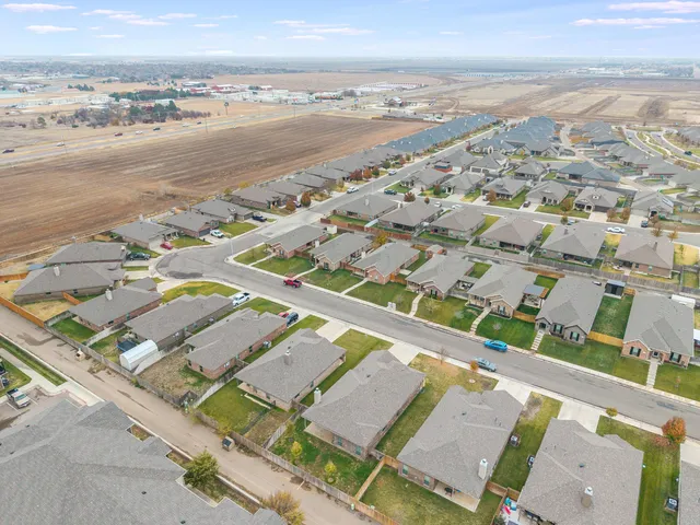 an aerial view of residential building with beach