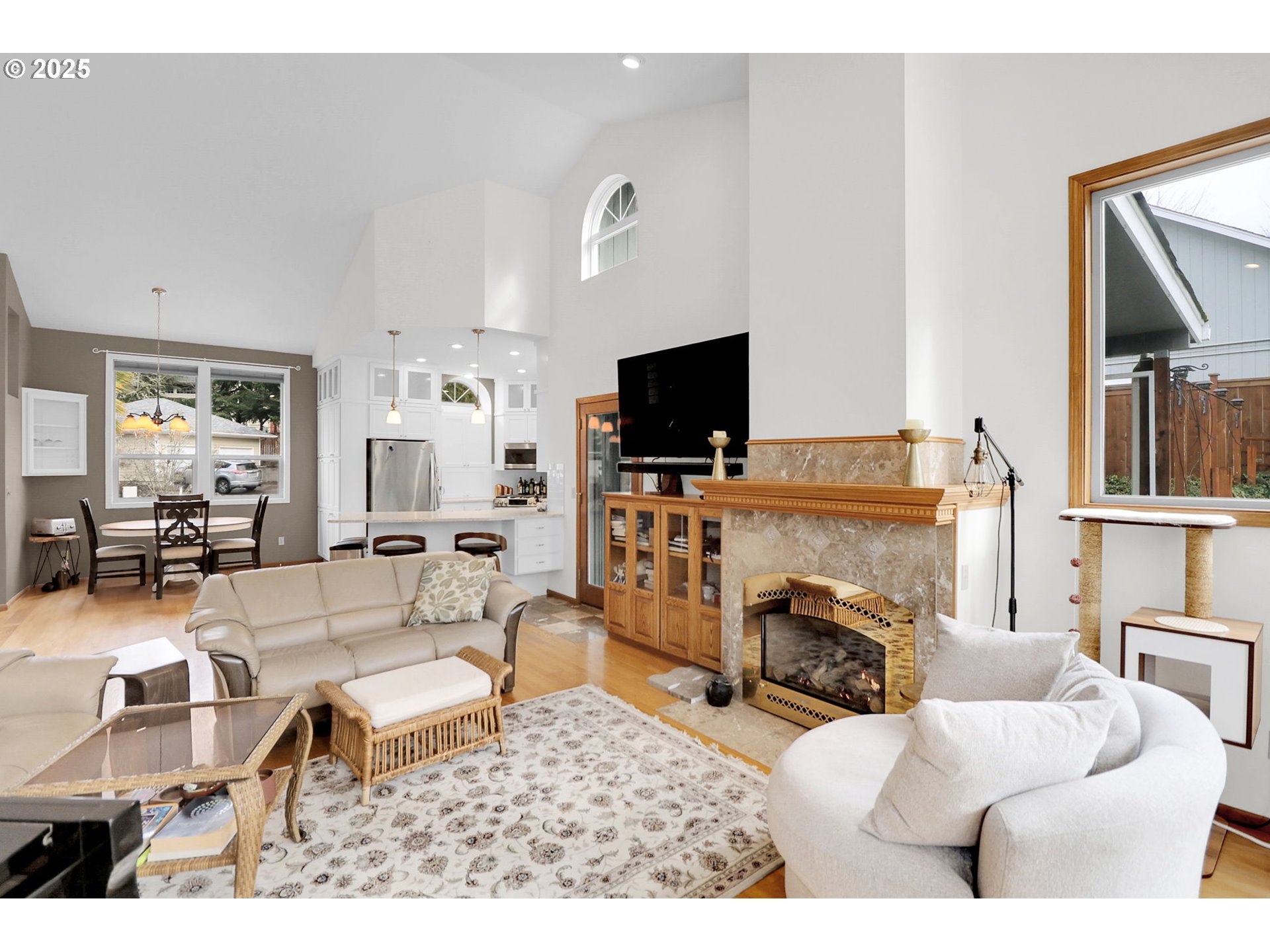 2708 Moon Mountain Drive Eugene, OR 97403 - Photo 15 of 43 a living room with furniture a fireplace and a flat screen tv