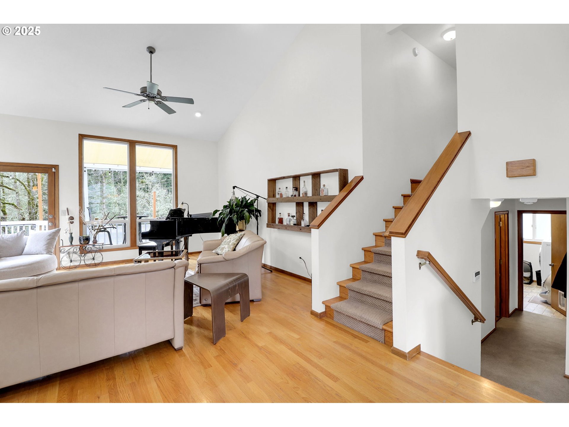 2708 Moon Mountain Drive Eugene, OR 97403 - Photo 17 of 43 a living room with furniture and a dining table with wooden floor