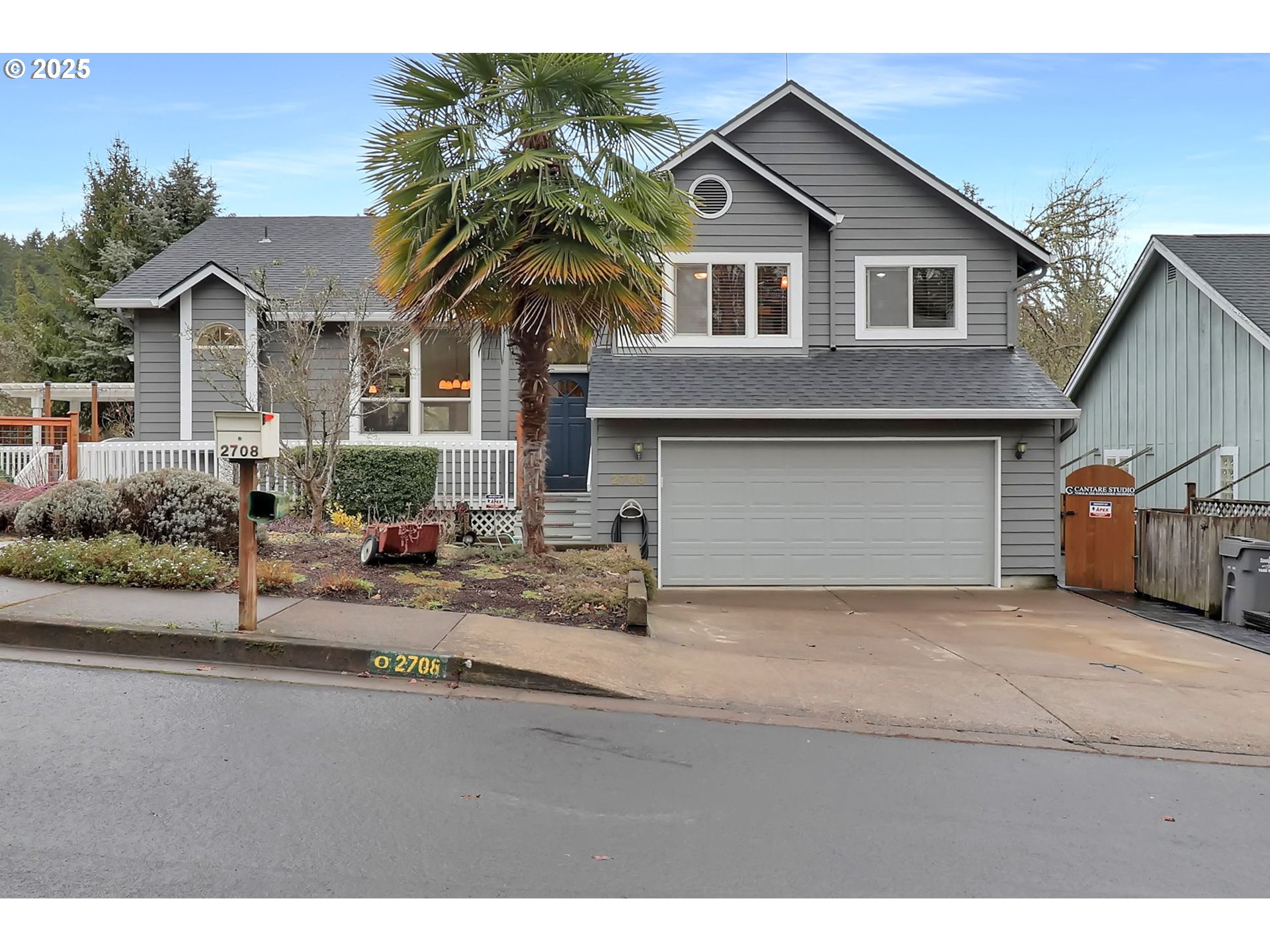 2708 Moon Mountain Drive Eugene, OR 97403 - Photo 2 of 43 a front view of a house with a yard and garage