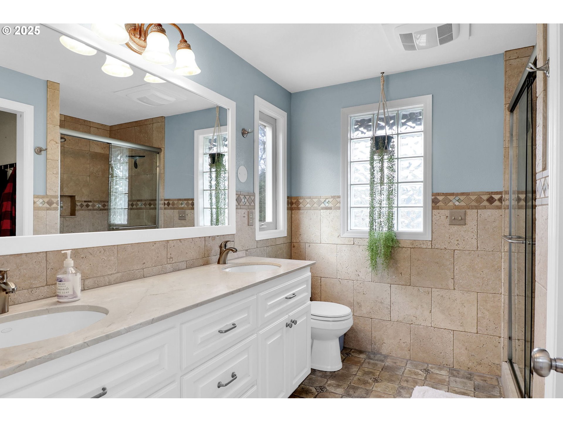 2708 Moon Mountain Drive Eugene, OR 97403 - Photo 22 of 43 a bathroom with a granite countertop sink a toilet a mirror and shower