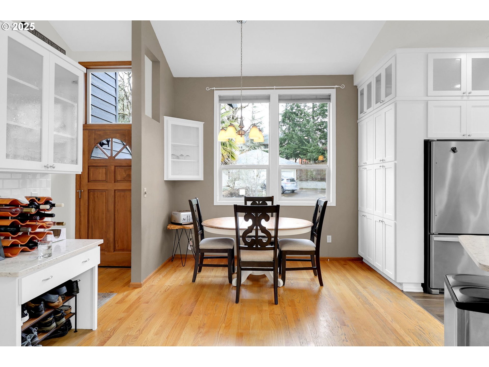 2708 Moon Mountain Drive Eugene, OR 97403 - Photo 3 of 43 a view of a dining room with furniture window and wooden floor