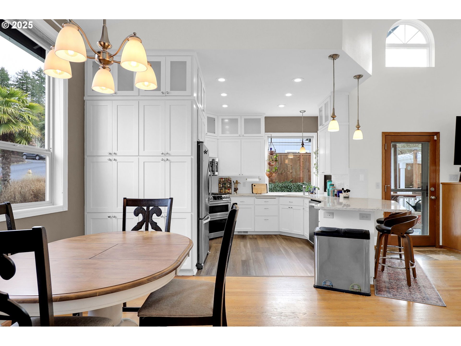 2708 Moon Mountain Drive Eugene, OR 97403 - Photo 4 of 43 a living room with stainless steel appliances kitchen island granite countertop furniture and a large window