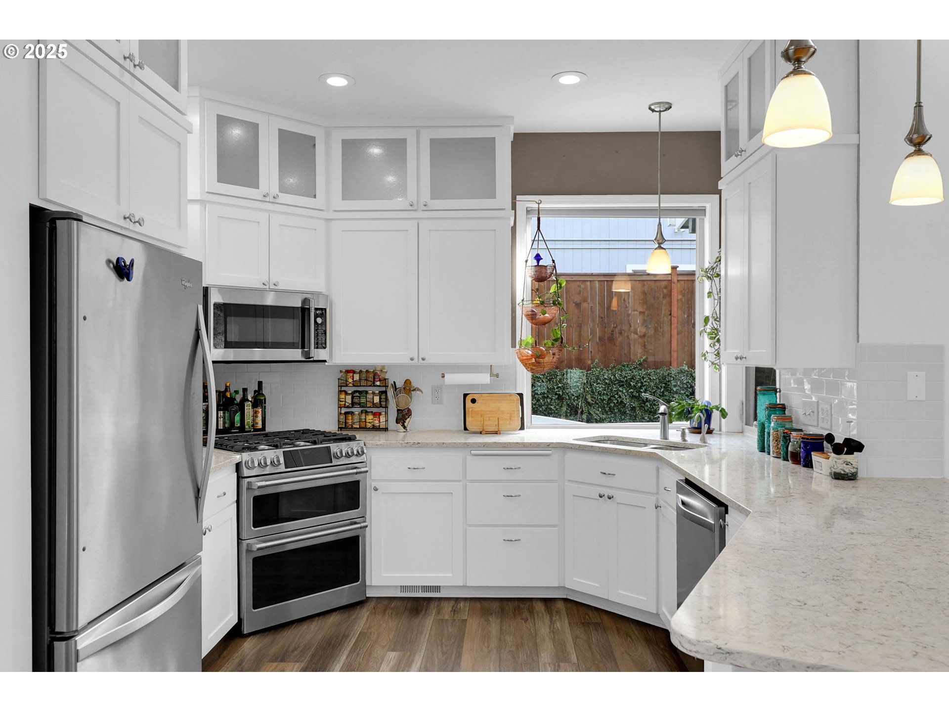 2708 Moon Mountain Drive Eugene, OR 97403 - Photo 6 of 43 a kitchen with stainless steel appliances a refrigerator sink and cabinets