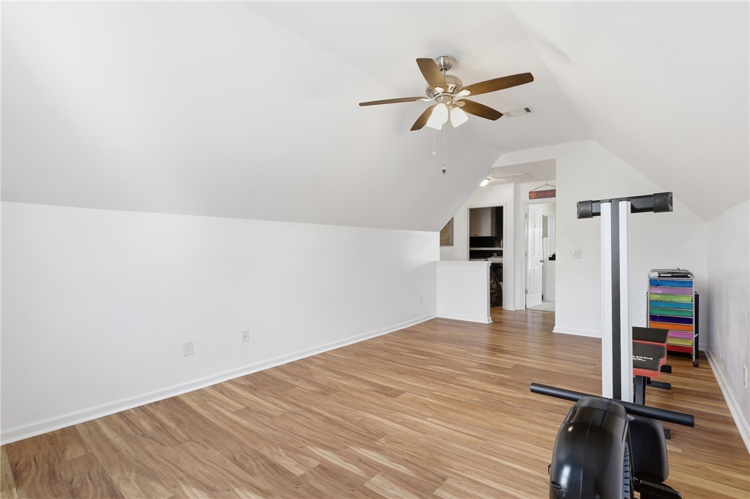 347 Riverdale Road Simpsonville, SC 29680 - Photo 20 of 30 This spacious bonus room features warm wood flooring, offering versatile living options.