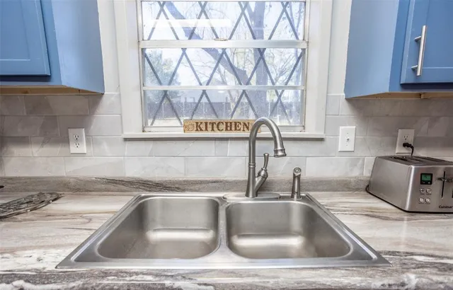 a kitchen sink with a stove