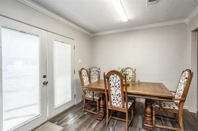 a view of a dining room with furniture and window