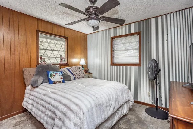 a bedroom with bed and window