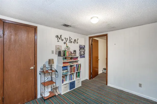 a view of a livingroom with shelves