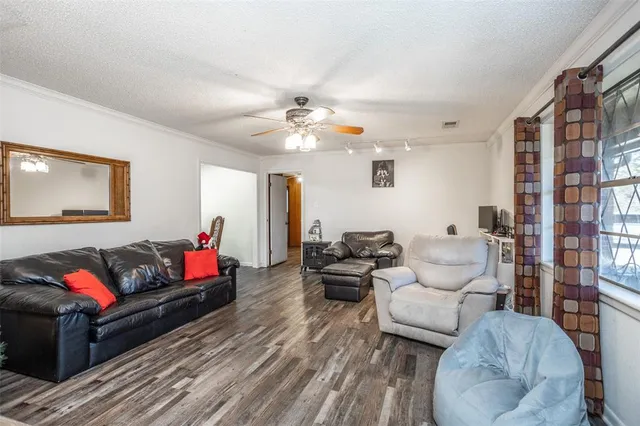 a living room with furniture and a lamp