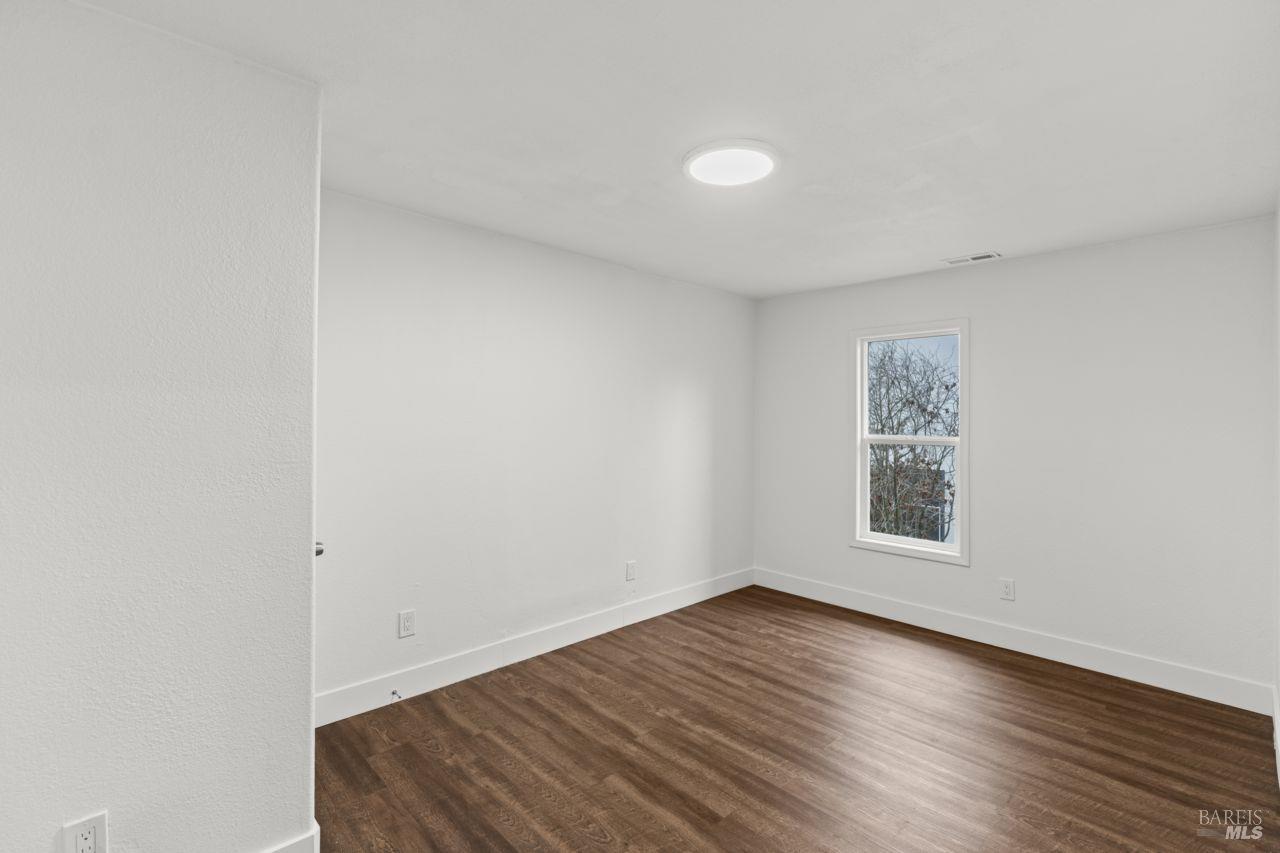 940 York Street Vallejo, CA 94590 - Photo 26 of 30 a view of an empty room with wooden floor and a window