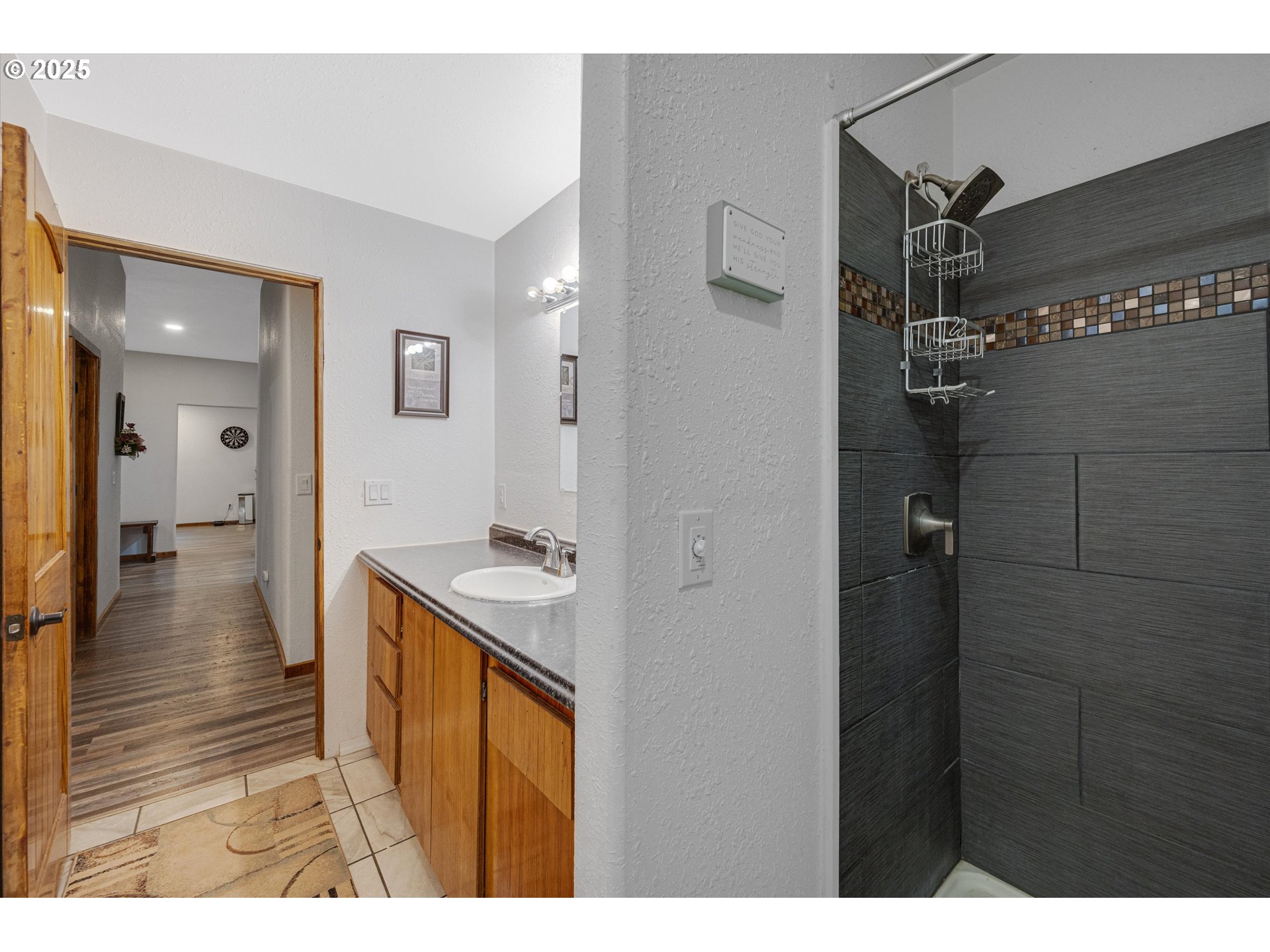 17205 Oakdale Road Dallas, OR 97338 - Photo 26 of 36 a bathroom with a sink mirror and shower