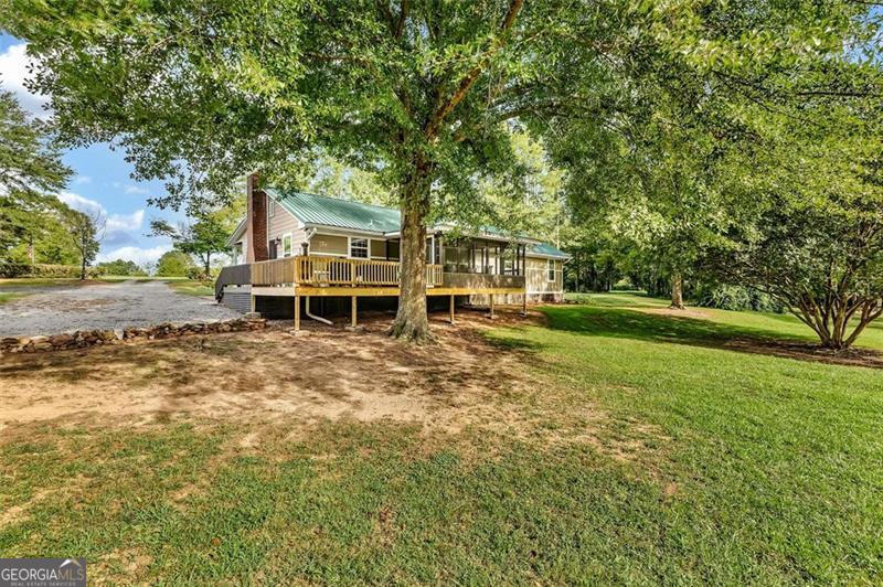 340 Tom Bell Road Milner, GA 30257 - Photo 5 of 34 front view of a house with a yard