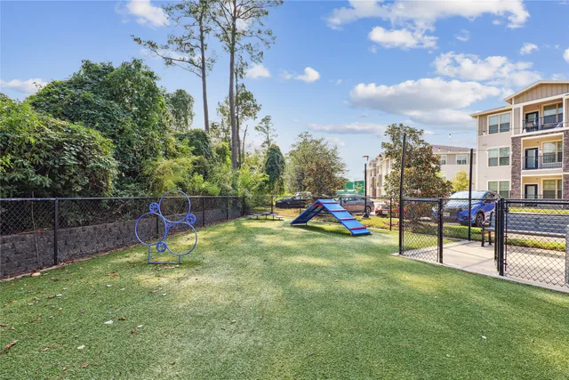 a view of a park with swings and slides