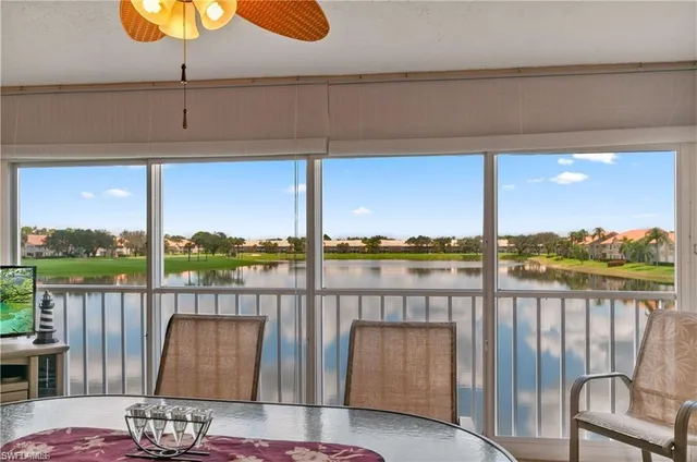 a roof deck with table and chairs