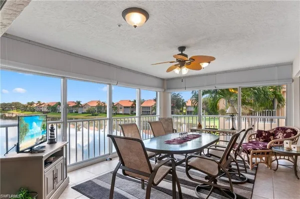 a dining room with furniture window and outside view