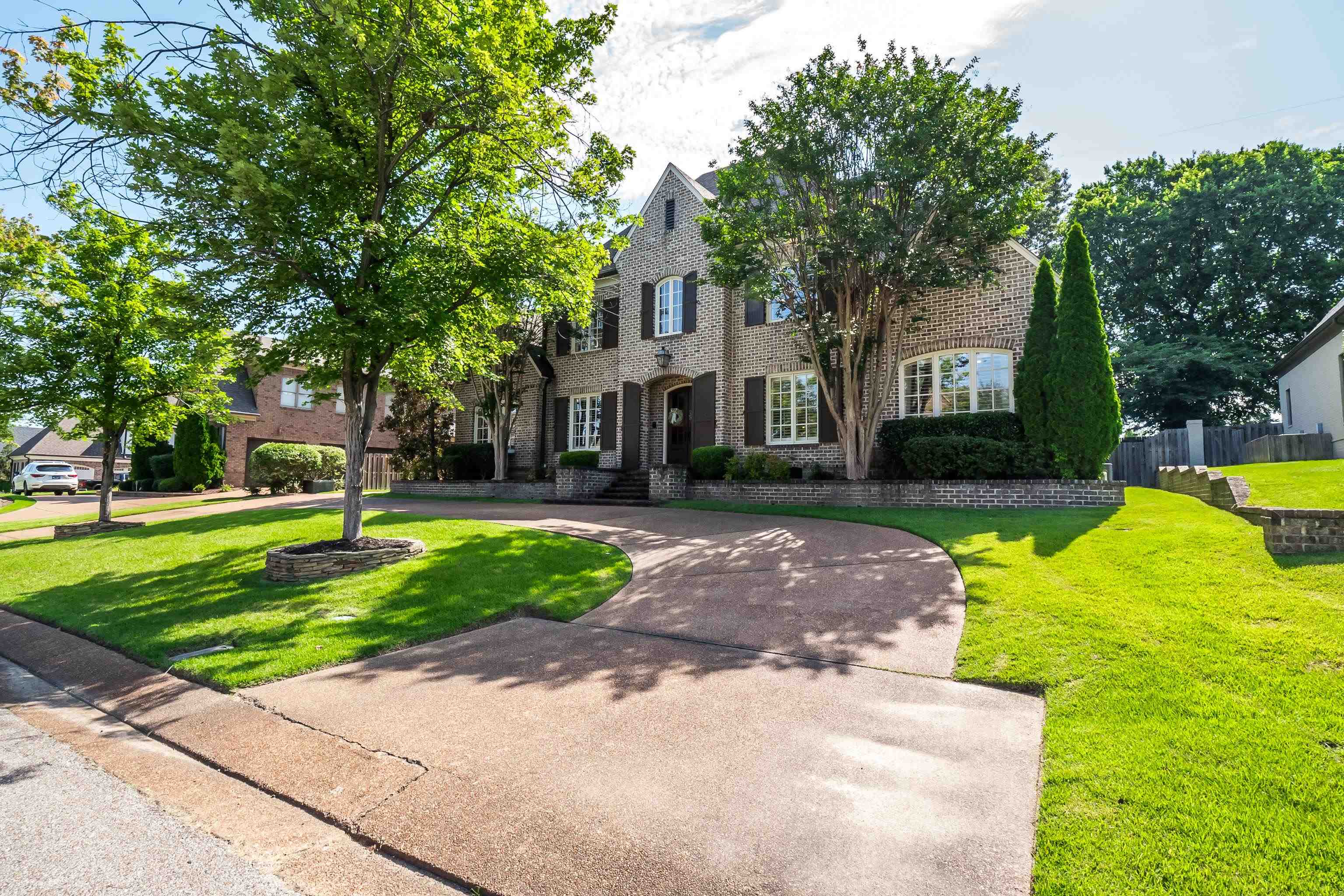 3174 Wetherby Drive Germantown, TN 38139 - Photo 1 of 40 a view of a house with a big yard plants and large trees
