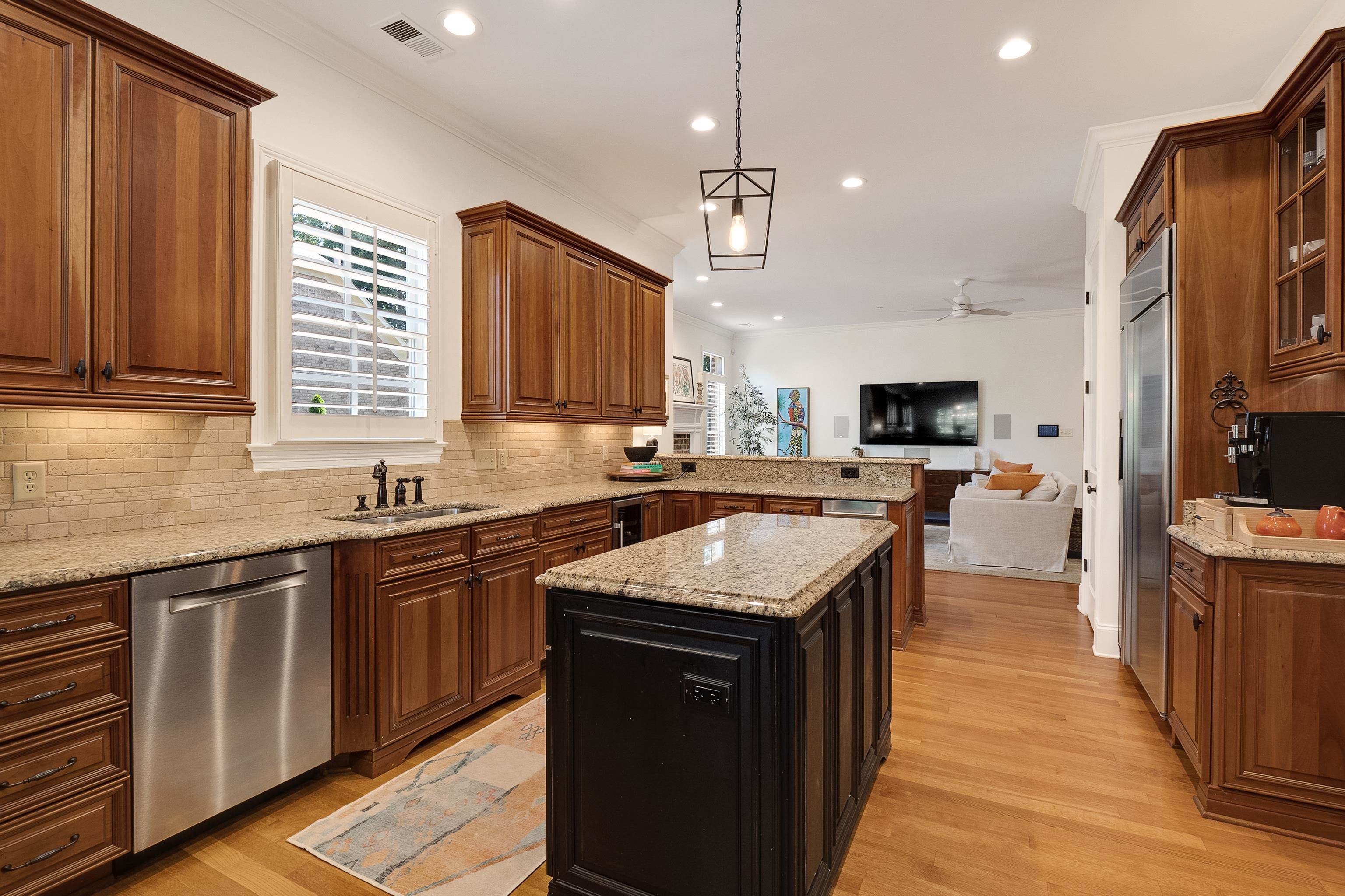 3174 Wetherby Drive Germantown, TN 38139 - Photo 13 of 40 a kitchen with stainless steel appliances granite countertop wooden cabinets a sink dishwasher a stove and a refrigerator