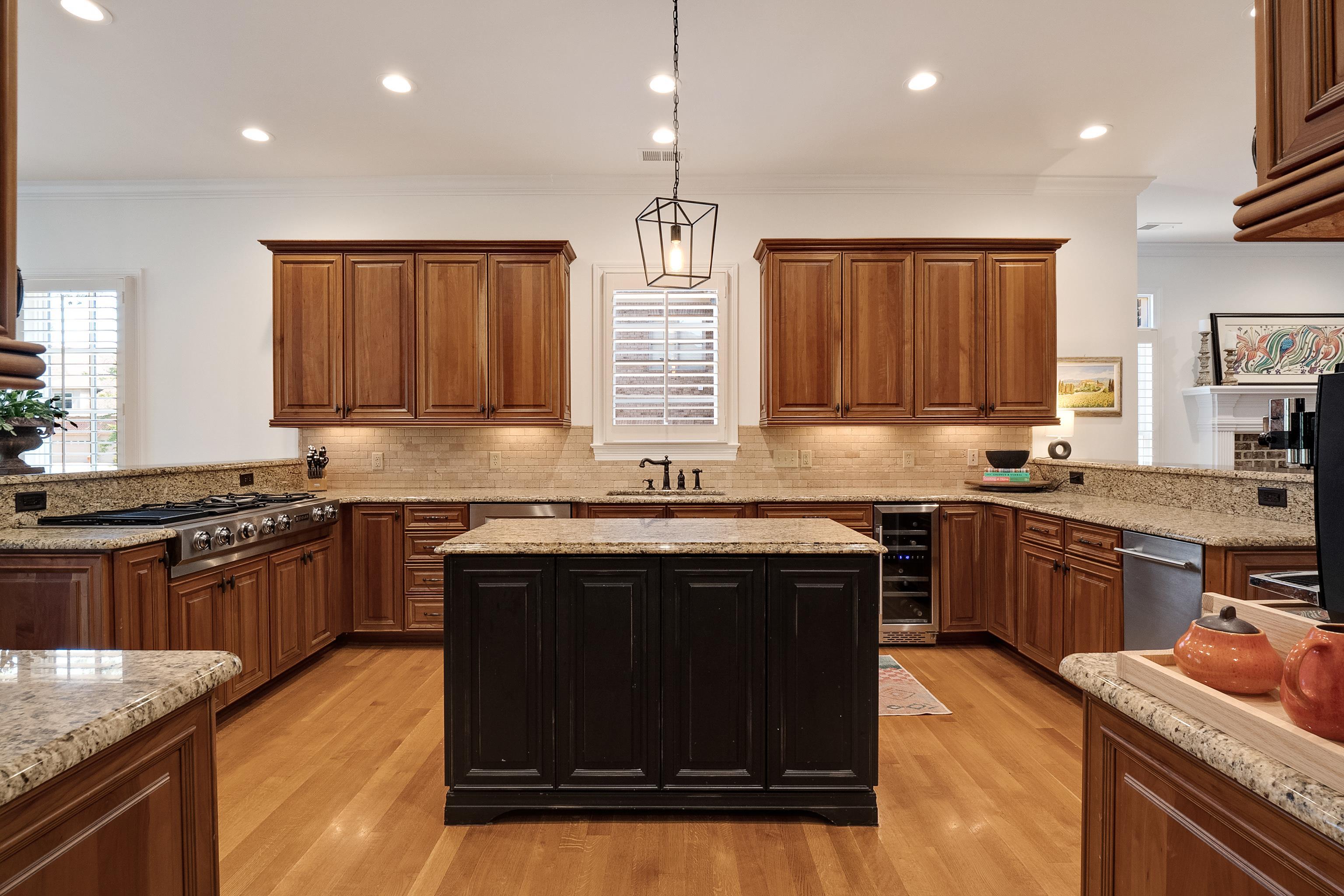 3174 Wetherby Drive Germantown, TN 38139 - Photo 14 of 40 a kitchen with stainless steel appliances granite countertop a stove a sink dishwasher and a microwave oven with wooden cabinets
