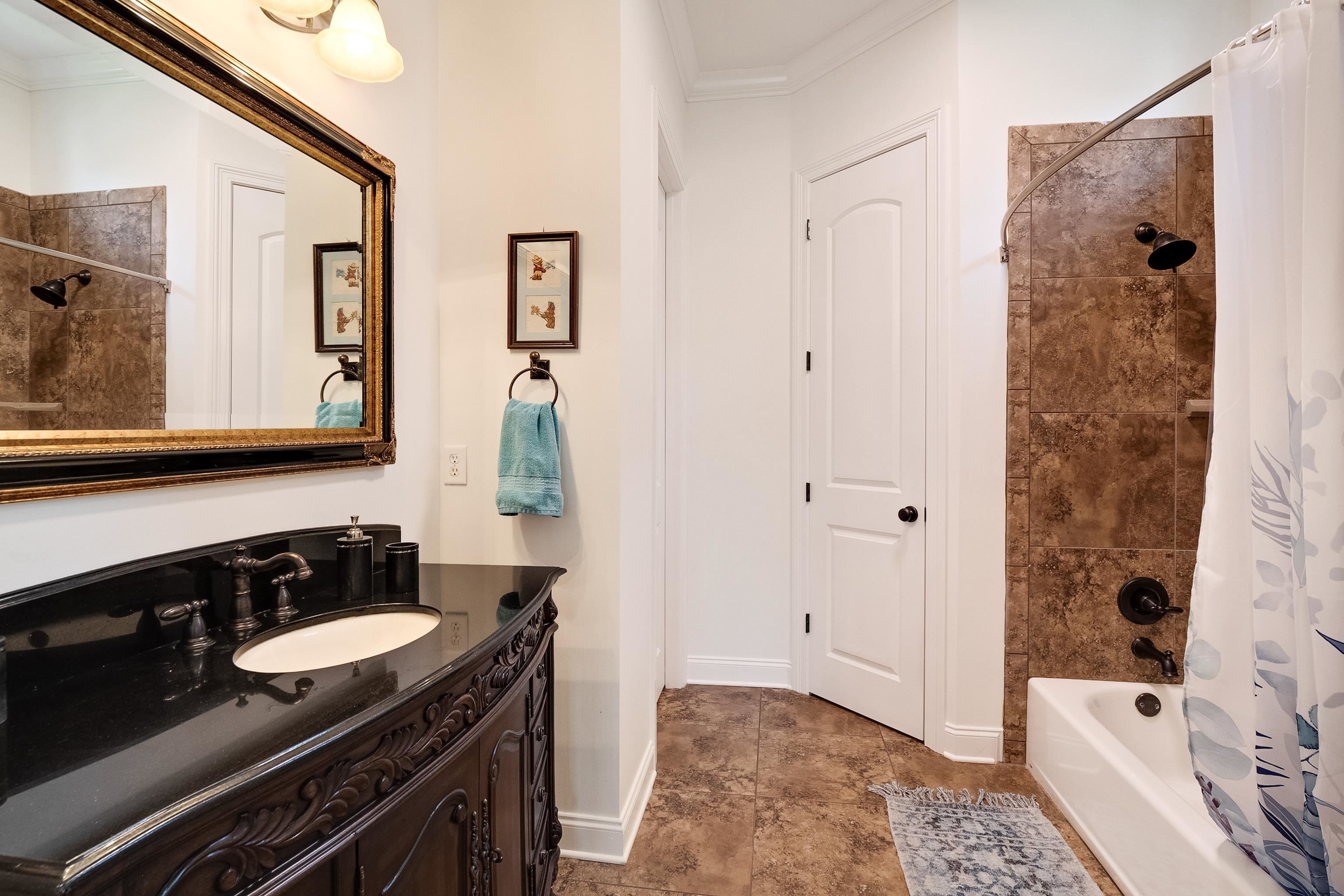 3174 Wetherby Drive Germantown, TN 38139 - Photo 24 of 40 a bathroom with a sink and a mirror