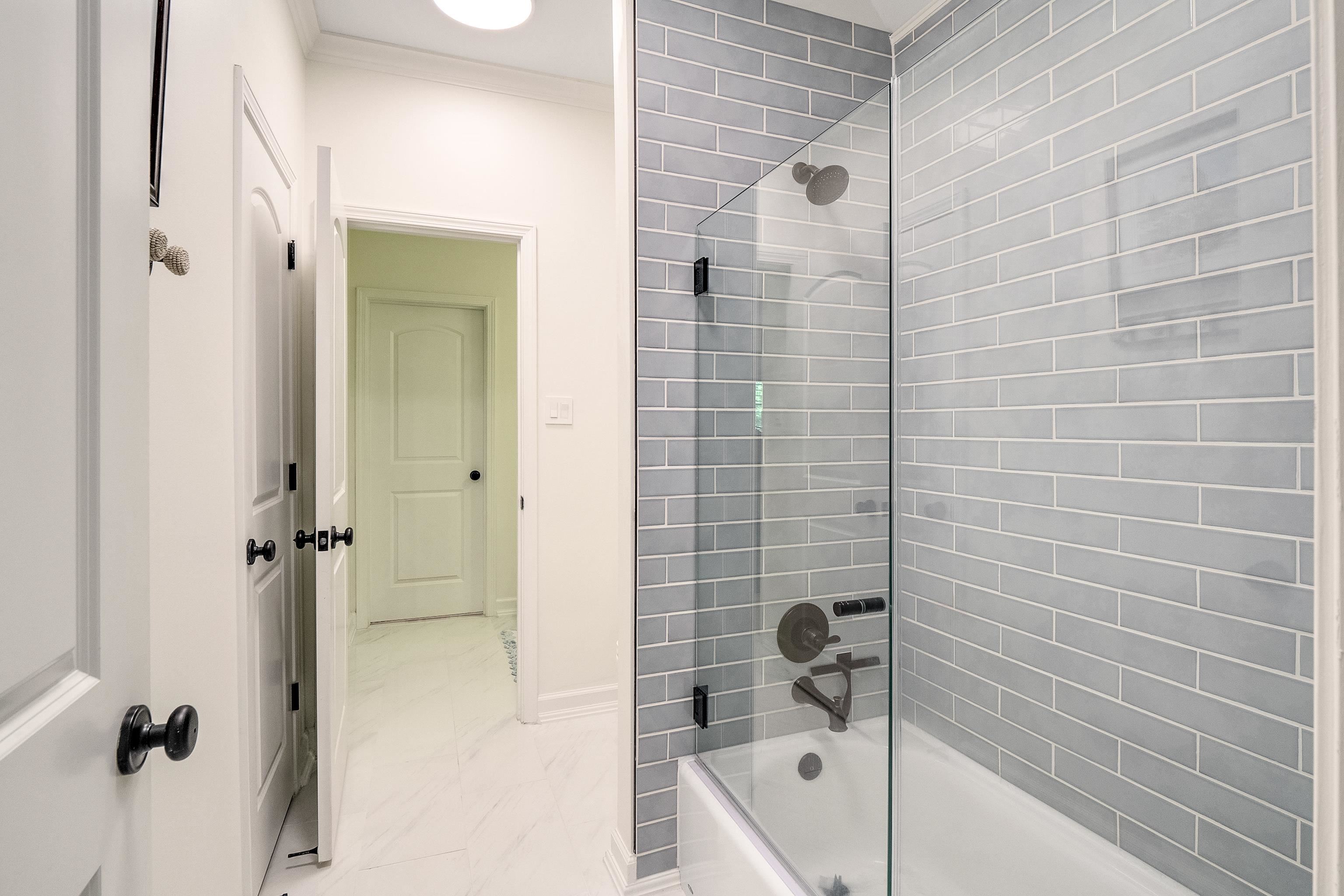 3174 Wetherby Drive Germantown, TN 38139 - Photo 30 of 40 a bathroom with a bathtub and shower