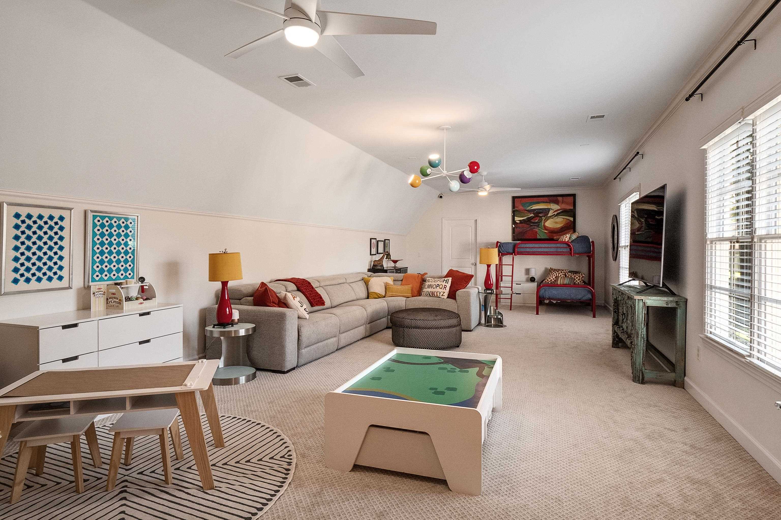 3174 Wetherby Drive Germantown, TN 38139 - Photo 31 of 40 a living room with furniture and a flat screen tv