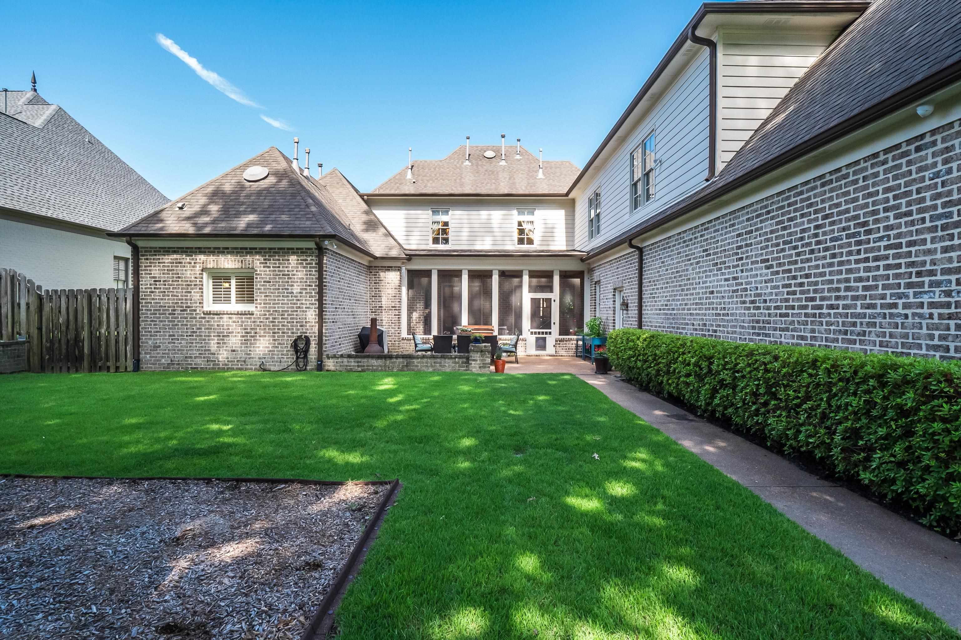 3174 Wetherby Drive Germantown, TN 38139 - Photo 37 of 40 a front view of a house with garden