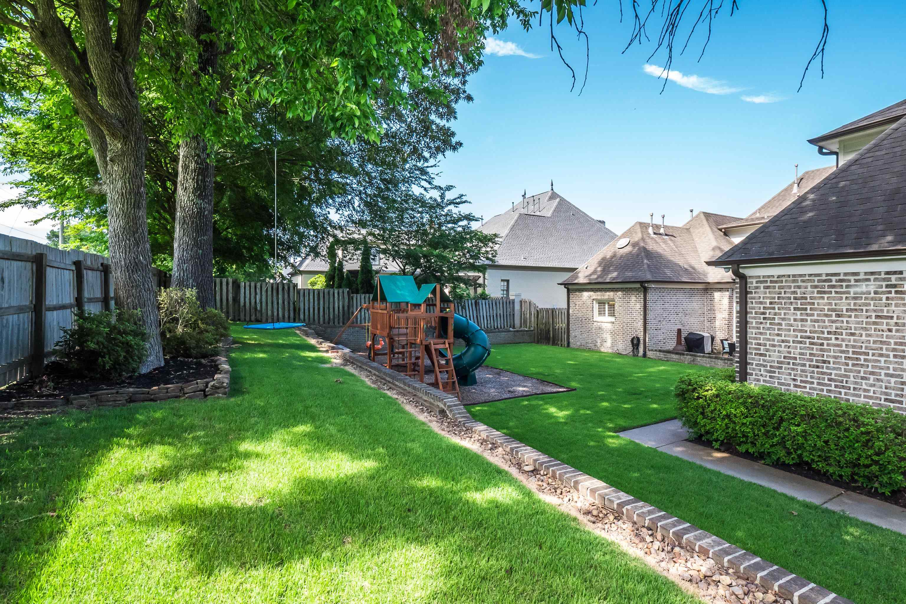 3174 Wetherby Drive Germantown, TN 38139 - Photo 38 of 40 a view of a house with a big yard potted plants and large tree