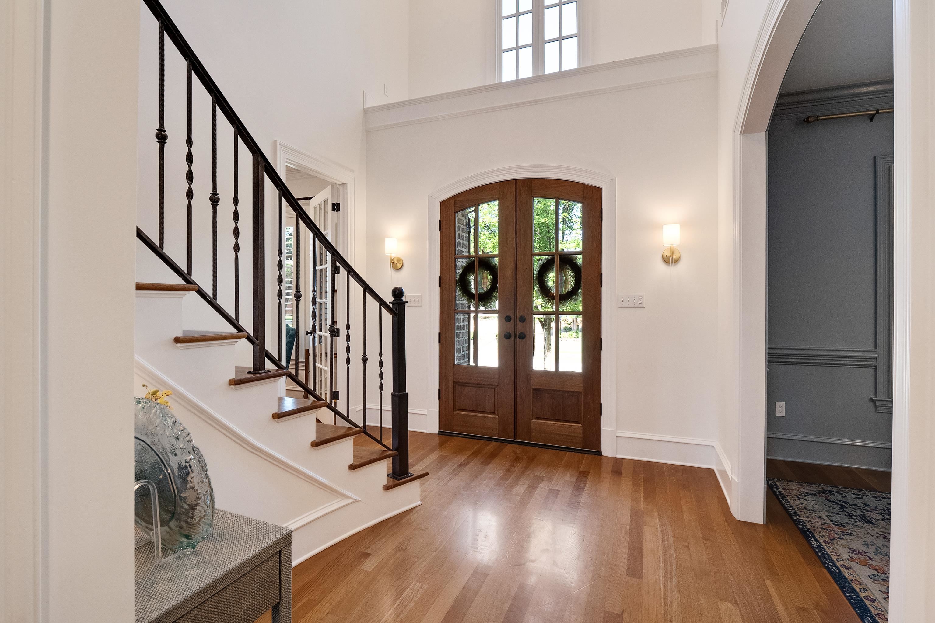 3174 Wetherby Drive Germantown, TN 38139 - Photo 4 of 40 a view of an entryway with wooden floor door windows and a chandelier