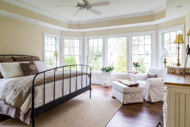 44 Shell Drive North Chatham, MA 02650 - Photo 16 of 34 a spacious bedroom with a bed and a couch next to a window