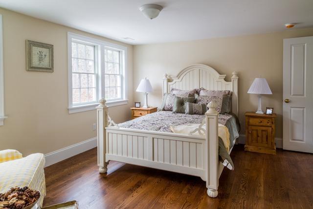 44 Shell Drive North Chatham, MA 02650 - Photo 22 of 34 a bedroom with a bed and wooden floor