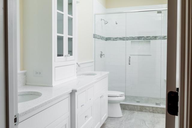 44 Shell Drive North Chatham, MA 02650 - Photo 26 of 34 a bathroom with a granite countertop sink a toilet and a shower