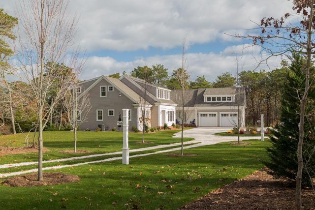 44 Shell Drive North Chatham, MA 02650 - Photo 3 of 34 a view of a house with a big yard and large trees