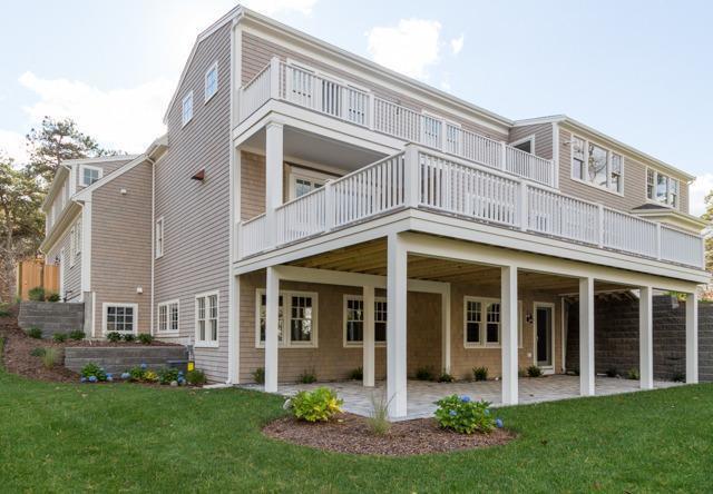 44 Shell Drive North Chatham, MA 02650 - Photo 4 of 34 front view of a brick house with a yard