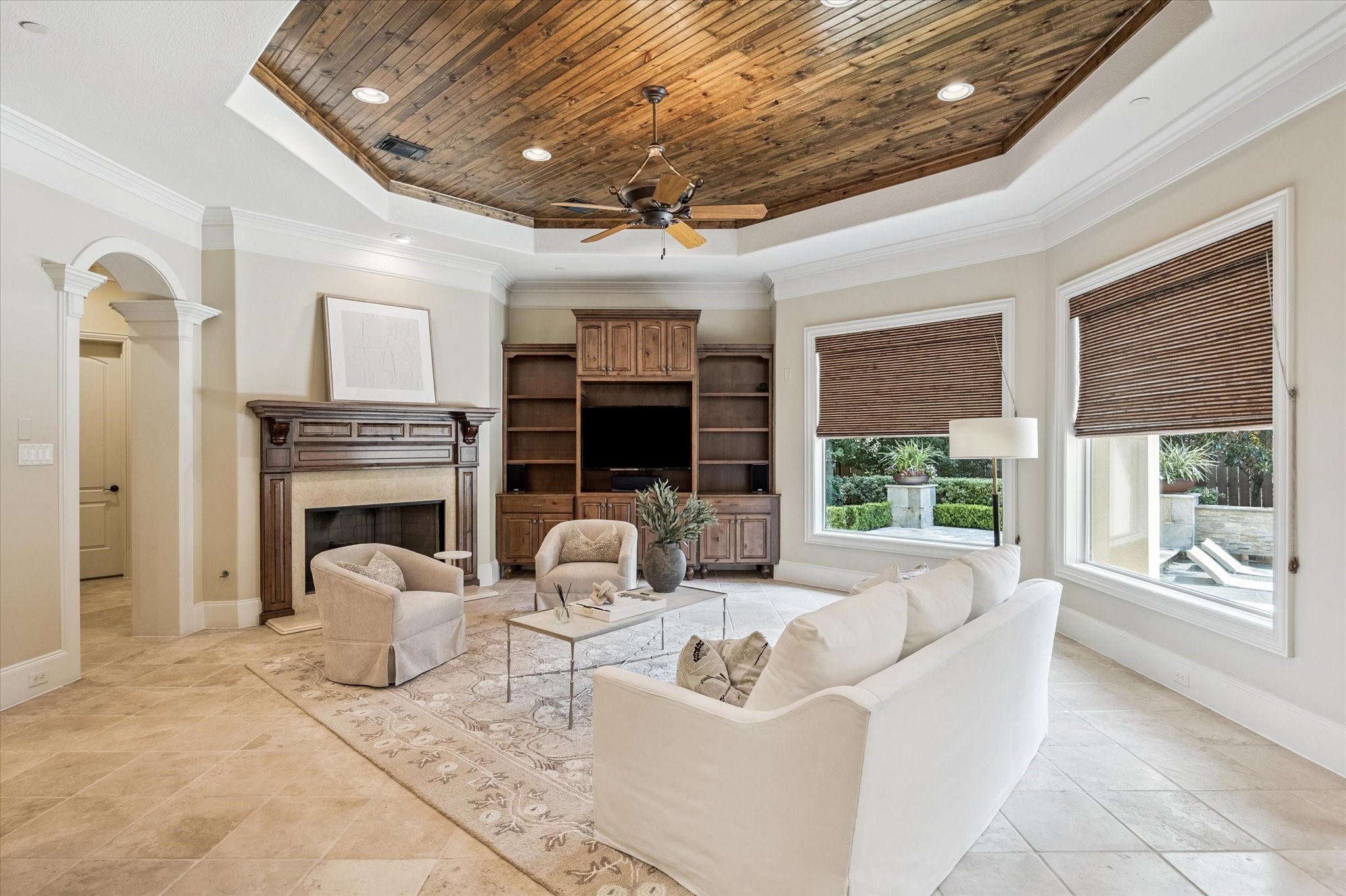 570 Lanecrest Lane Houston, TX 77024 - Photo 17 of 36 a living room with furniture large windows and a fireplace