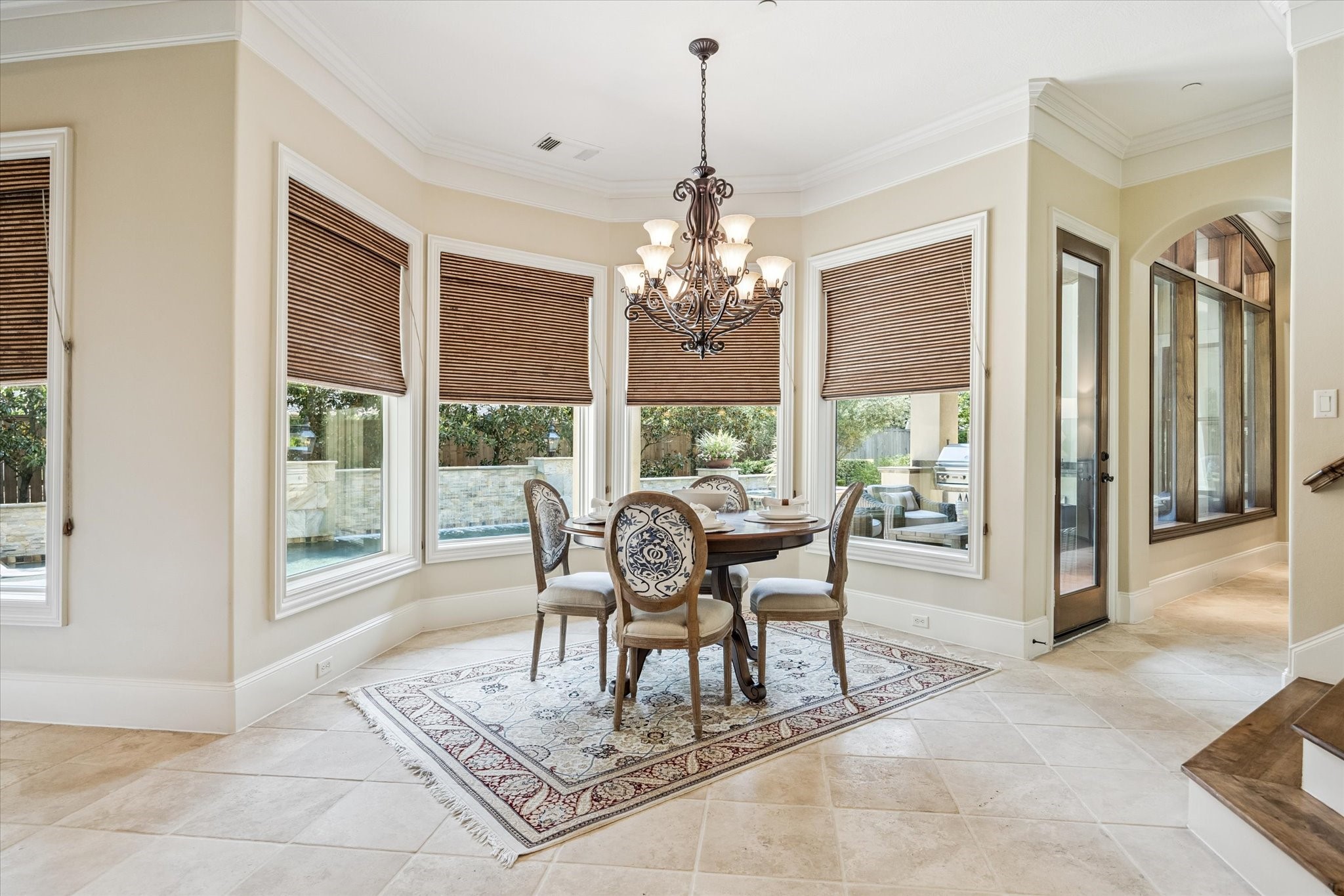 570 Lanecrest Lane Houston, TX 77024 - Photo 19 of 36 a dining room with furniture a chandelier and wooden floor