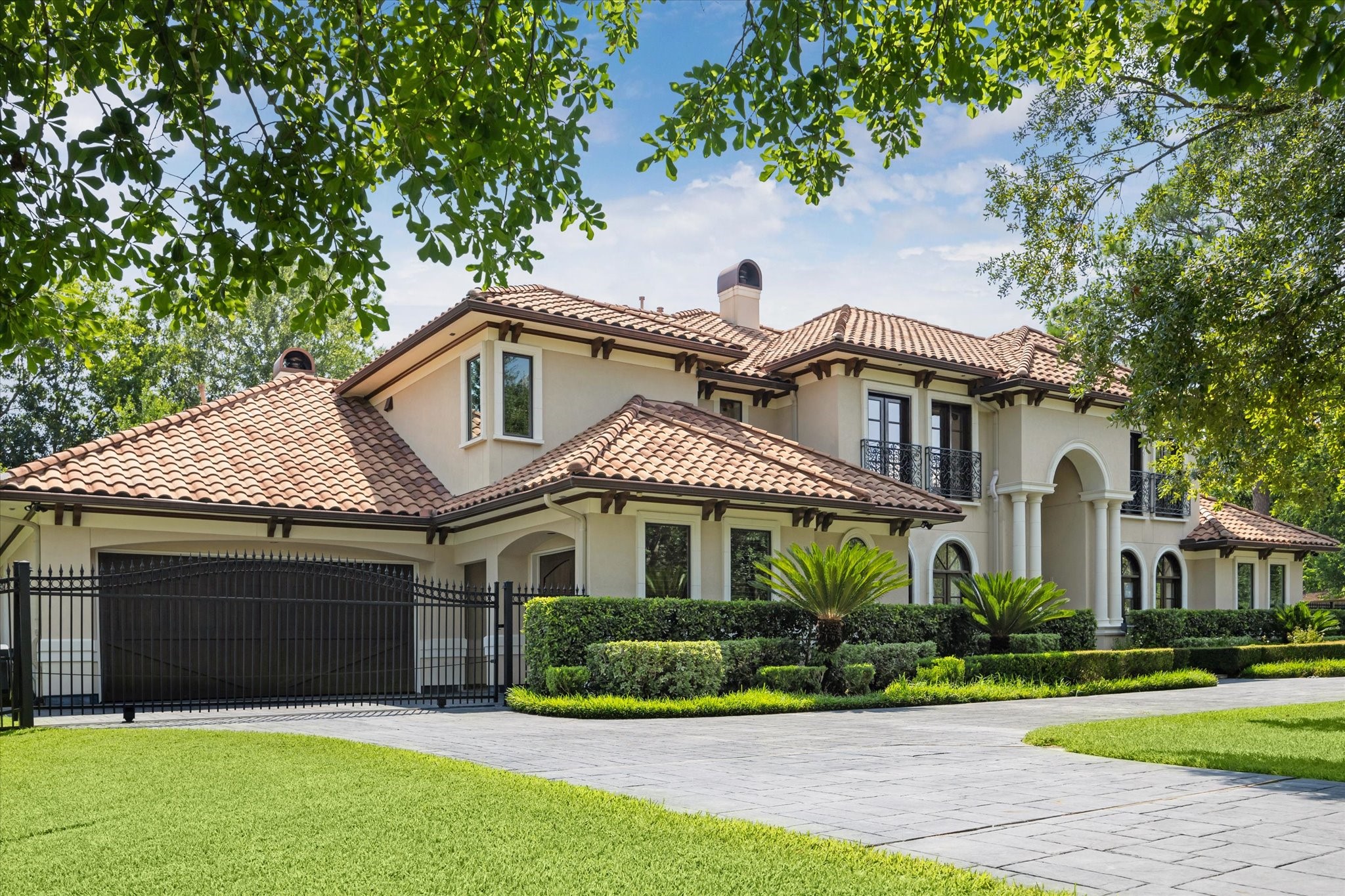 570 Lanecrest Lane Houston, TX 77024 - Photo 2 of 36 a front view of a house with a garden and plants