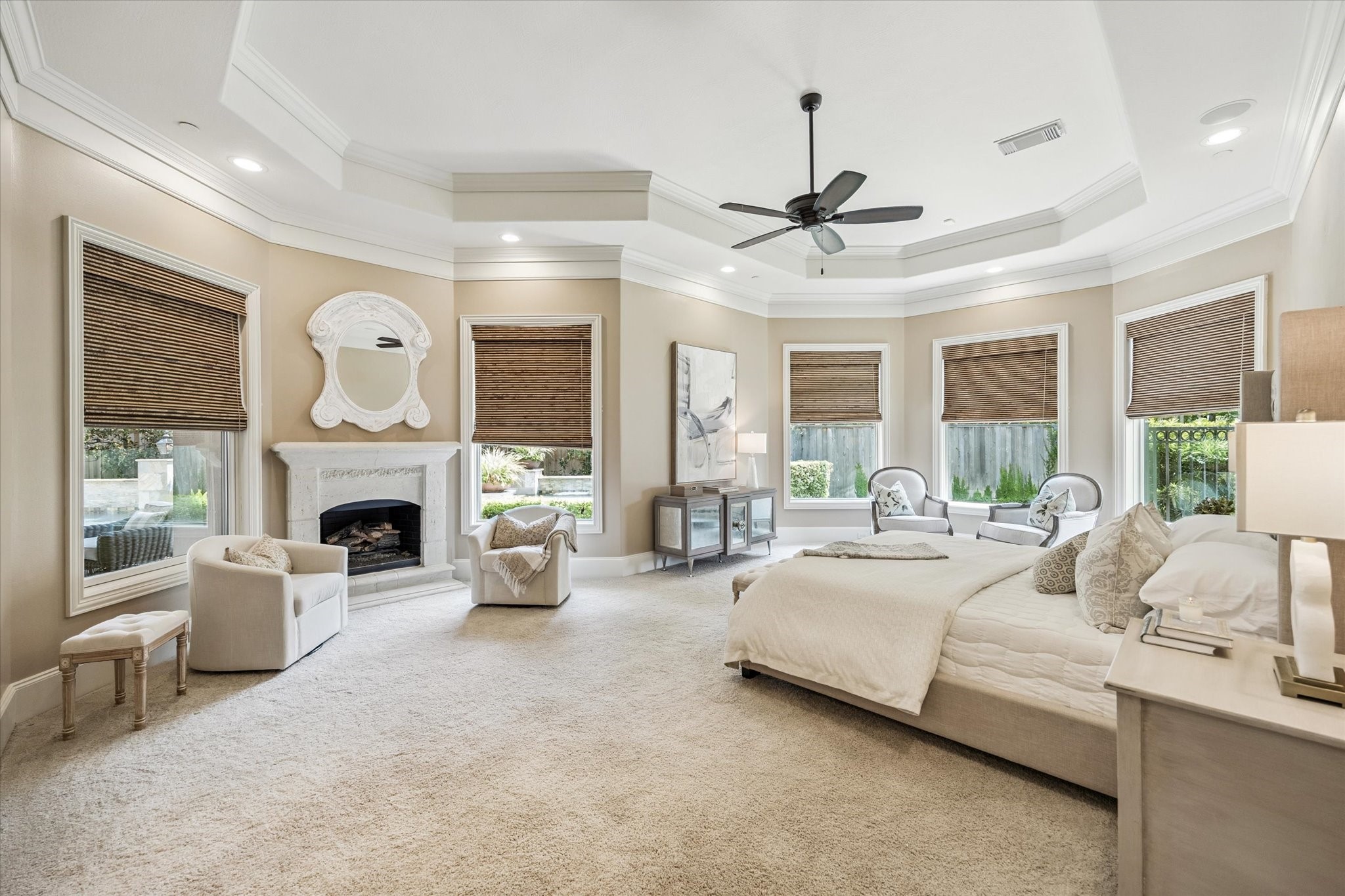 570 Lanecrest Lane Houston, TX 77024 - Photo 22 of 36 a large bedroom with furniture fireplace and window