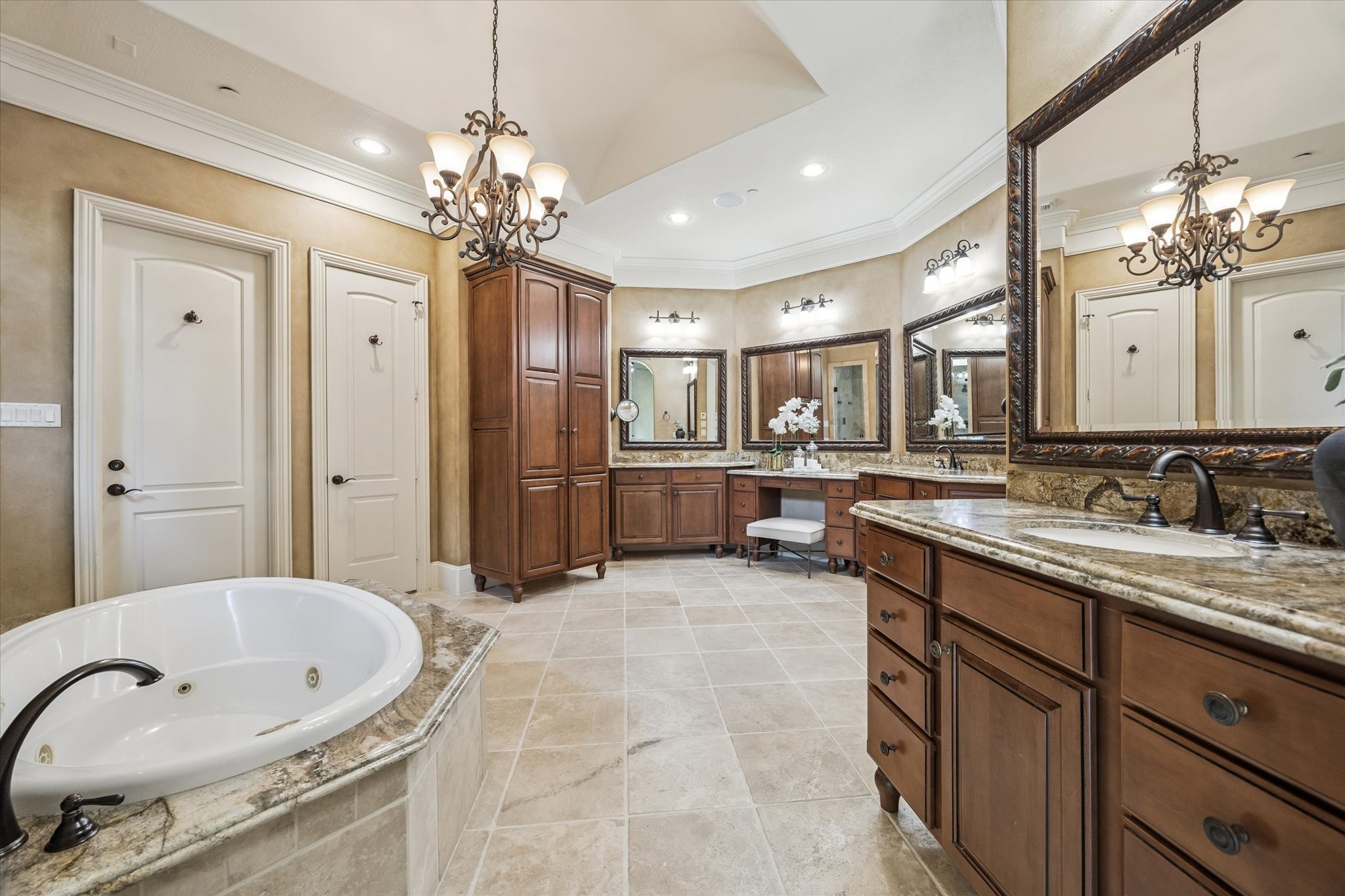 570 Lanecrest Lane Houston, TX 77024 - Photo 23 of 36 a spacious bathroom with a sink double vanity granite and a mirror