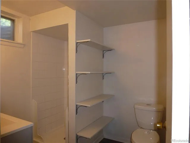 a bathroom with a sink mirror and vanity