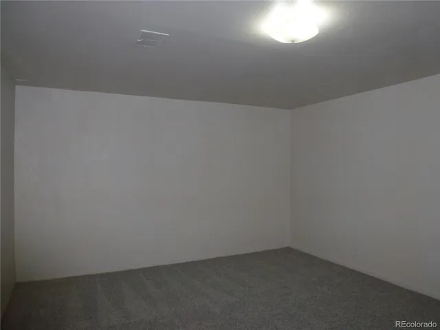 a room with a sink cabinets and utility room