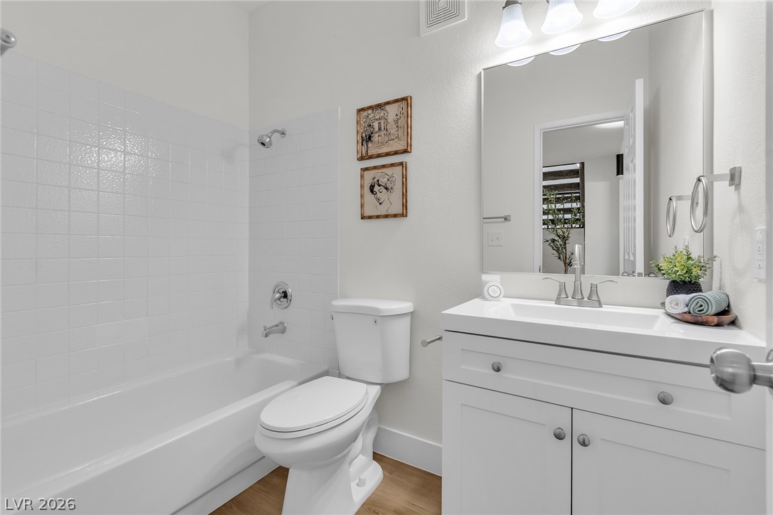 370 Rushing Creek Court Henderson, NV 89014 - Photo 25 of 32 Clean lines and classic tilework define this well-appointed bathroom.