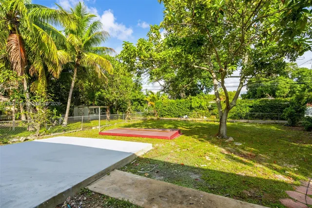 a view of a playground with basketball court