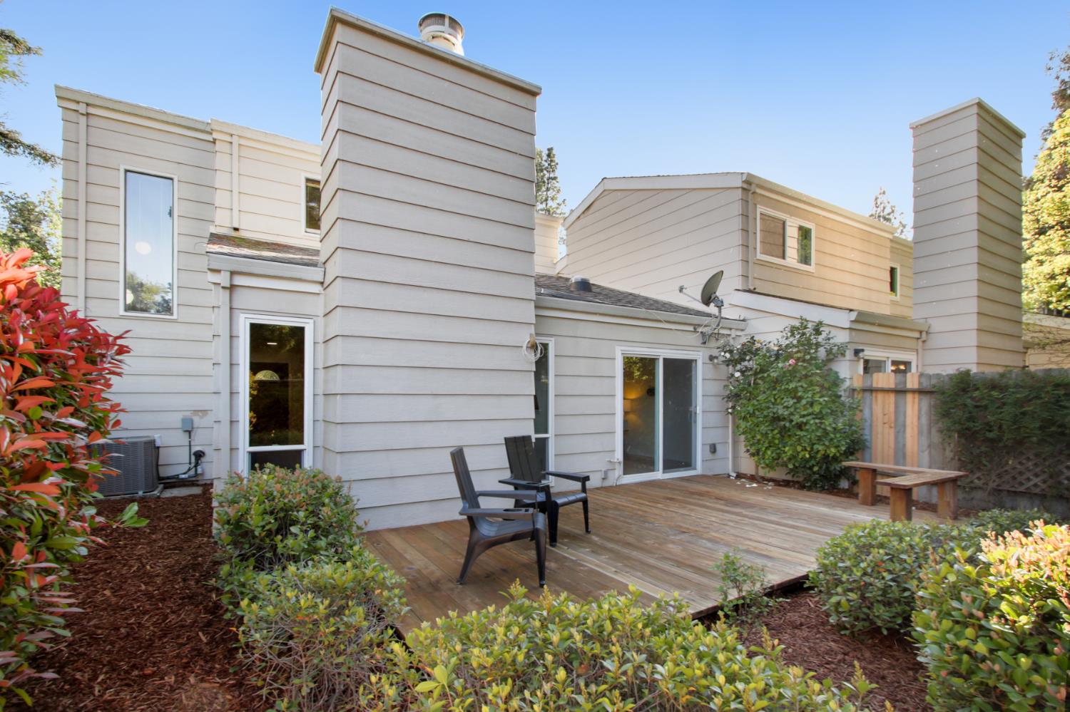 2033 Manet Place Davis, CA 95618 - Photo 39 of 56 rear view of house with a chimney and a deck