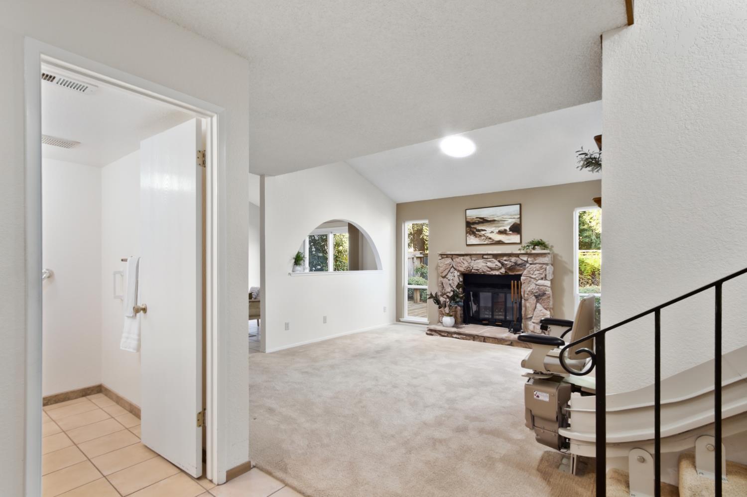 2033 Manet Place Davis, CA 95618 - Photo 5 of 56 living room with vaulted ceiling, plenty of natural light and a fireplace